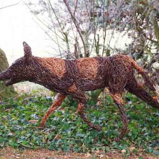 Willow sculpture of a wild dog