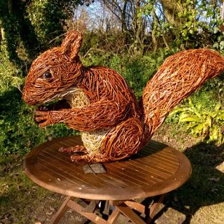 Willow sculpture of a giant red squirrel