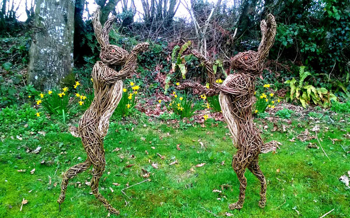 Willow sculpture of boxing hares