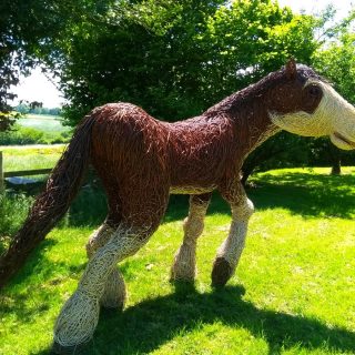Willow sculpture of a 7 foot high Clydesdale horse