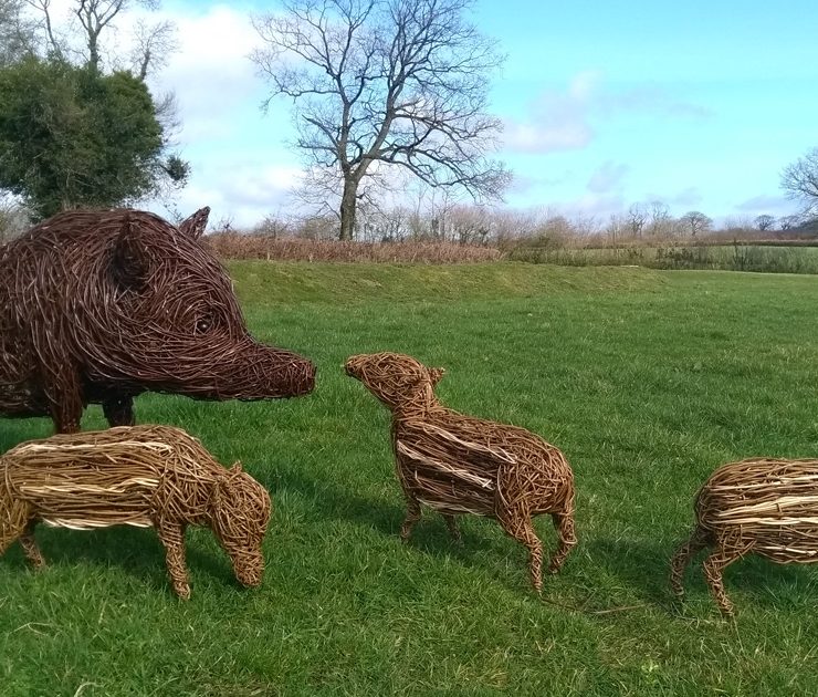 Willow sculpture of wild boar and piglets