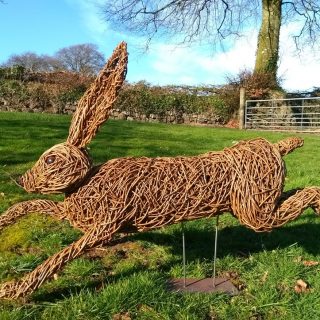 Willow sculpture of a running hare