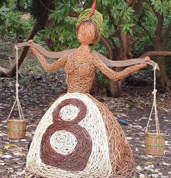 willow sculpture of 8 maids a milking