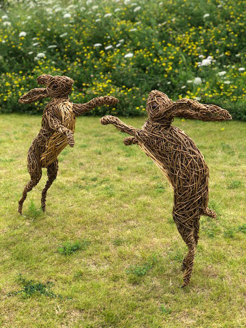 Boxing hares made of 2 colours of willow with resin eyes