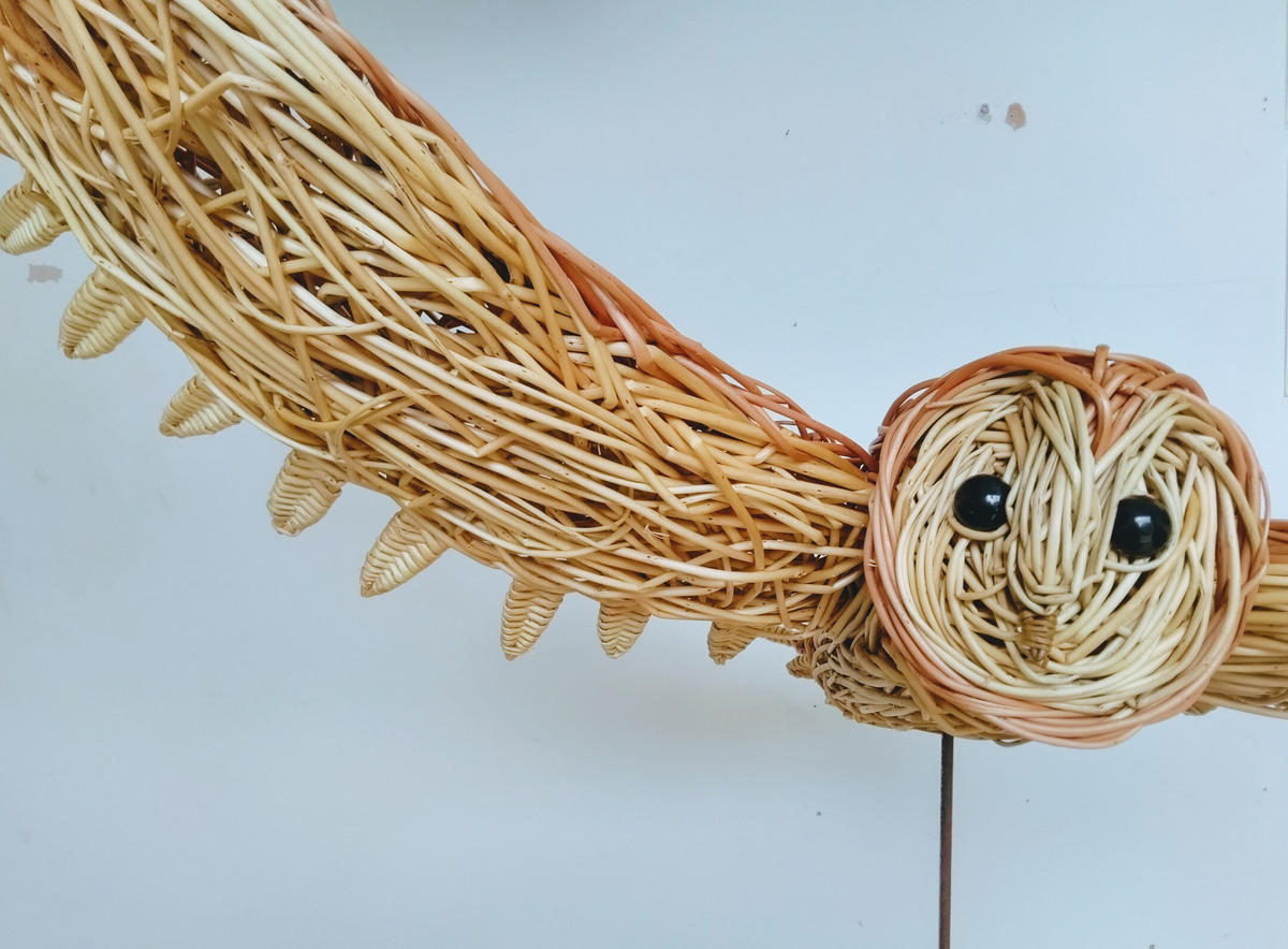 flying barn owl willow sculpture